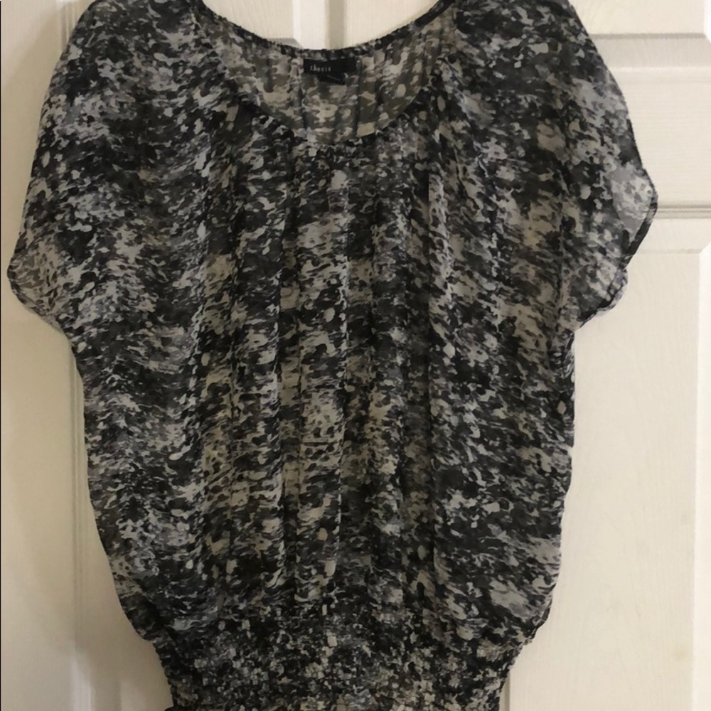 A black sleeveless sheer blouse size extra-large